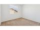 Cozy bedroom featuring neutral carpet, a large window, and electrical outlets at 15825 S 1St Ave, Phoenix, AZ 85045