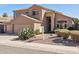 Two-story home featuring a tile roof, desert landscaping, and a manicured front yard at 15825 S 1St Ave, Phoenix, AZ 85045