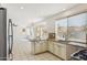 Bright kitchen featuring white cabinetry, granite countertops, stainless steel appliances, and tile floors at 15825 S 1St Ave, Phoenix, AZ 85045