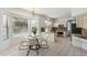 Bright eat-in kitchen with granite counters, island, stainless appliances, and backyard pool views at 15825 S 1St Ave, Phoenix, AZ 85045
