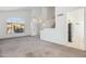 Open-concept living room featuring a large arched window at 15825 S 1St Ave, Phoenix, AZ 85045