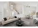 Spacious living room boasts high ceilings, ample natural light, open stairs and modern decor at 15825 S 1St Ave, Phoenix, AZ 85045