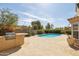 Inviting pool area with built-in barbecue, desert landscaping and mountain views at 15825 S 1St Ave, Phoenix, AZ 85045