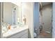 Clean bathroom with a modern vanity, mirror, and a shower, very well lit at 15843 S 177Th Ave, Goodyear, AZ 85338