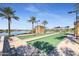 Bocce ball court by the lake with shaded seating and palm trees at 15843 S 177Th Ave, Goodyear, AZ 85338