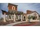 Exterior shot of the Cantamia model home center, with an arched entrance and decorative pergola at 15843 S 177Th Ave, Goodyear, AZ 85338