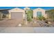 Charming single-story home with a desert-landscaped front yard and a two-car garage at 15843 S 177Th Ave, Goodyear, AZ 85338