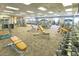 Well equipped gym and fitness center with weight machines and free weights with carpet flooring and drop ceiling at 15843 S 177Th Ave, Goodyear, AZ 85338