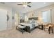 Comfortable main bedroom with large bed, soft carpet, and ample natural light at 15843 S 177Th Ave, Goodyear, AZ 85338