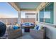 Comfortable outdoor patio with wicker furniture, accent pillows, and overhead string lights at 15843 S 177Th Ave, Goodyear, AZ 85338