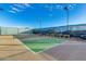 Outdoor community pickleball court with dark fencing and street lights at 15843 S 177Th Ave, Goodyear, AZ 85338