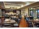 The restaurant features dark wood tables and chairs, recessed lighting, and a view of the kitchen and surrounding area at 15843 S 177Th Ave, Goodyear, AZ 85338