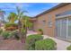 The backyard features a covered patio, desert landscaping, and easy access to indoor-outdoor living, perfect for relaxing at 16215 W Indianola Ave, Goodyear, AZ 85395