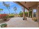 Charming covered back patio with picturesque landscaping, perfect for outdoor entertaining and relaxation at 16215 W Indianola Ave, Goodyear, AZ 85395