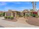 Landscaped home exterior with a two-car garage, desert landscaping, and a curved walkway to the front door at 16215 W Indianola Ave, Goodyear, AZ 85395