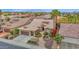 Beautiful home featuring manicured landscaping, a desert yard, and a spacious three-car garage at 16215 W Indianola Ave, Goodyear, AZ 85395
