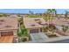 A well-maintained home boasts beautiful landscaping, a desert yard, and a convenient three-car garage at 16215 W Indianola Ave, Goodyear, AZ 85395