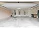 Spacious garage with ample storage, overhead lighting, and room for multiple vehicles at 16215 W Indianola Ave, Goodyear, AZ 85395