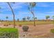 A golf course view enhances the property's appeal with mature trees and well-manicured landscaping at 16215 W Indianola Ave, Goodyear, AZ 85395