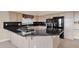 Beautiful kitchen featuring granite countertops, gas stovetop, and modern appliances at 16215 W Indianola Ave, Goodyear, AZ 85395