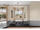 Spacious kitchen island with a built-in gas cooktop and scenic views through the window at 16215 W Indianola Ave, Goodyear, AZ 85395
