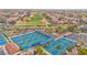 Multiple pickleball courts surrounded by lush landscaping enhance the community's appeal, showcasing active living at 16215 W Indianola Ave, Goodyear, AZ 85395