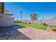 Fenced backyard showcasing a lush green lawn and hardscape at 1660 W 7Th Pl, Mesa, AZ 85201