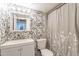 Bathroom featuring floral wallpaper, a modern sink, and a shower with a stylish curtain at 1660 W 7Th Pl, Mesa, AZ 85201