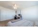 Bright bedroom featuring a built-in workstation and ample closet space at 1660 W 7Th Pl, Mesa, AZ 85201