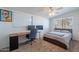 Bedroom with a dedicated workstation, ceiling fan, and comfortable decor at 1660 W 7Th Pl, Mesa, AZ 85201
