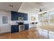 Clean kitchen design featuring eat-in breakfast bar and access to exterior at 1660 W 7Th Pl, Mesa, AZ 85201