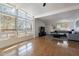 Bright living room featuring large windows, concrete floors, and a comfortable gray sofa at 1660 W 7Th Pl, Mesa, AZ 85201