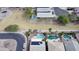 Drone shot of several backyards each featuring sparkling pools, desert landscaping, and solar panels at 17705 N Vera Cruz Ave, Maricopa, AZ 85139