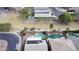 Beautiful aerial view of backyards, each offering a refreshing pool and desert landscaping with mature trees at 17705 N Vera Cruz Ave, Maricopa, AZ 85139