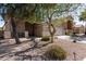 Charming single-story home showcasing well-maintained desert landscaping and a neutral color palette at 17705 N Vera Cruz Ave, Maricopa, AZ 85139