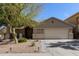 Charming single-story home showcasing well-maintained desert landscaping and a neutral color palette at 17705 N Vera Cruz Ave, Maricopa, AZ 85139
