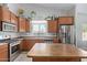 Spacious kitchen with stainless steel appliances, center island, and ample storage at 17705 N Vera Cruz Ave, Maricopa, AZ 85139
