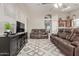Spacious living room featuring comfortable leather seating and stylish decor at 17705 N Vera Cruz Ave, Maricopa, AZ 85139
