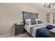 Comfortable main bedroom featuring a stylish bed frame and bedside table at 17705 N Vera Cruz Ave, Maricopa, AZ 85139