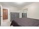 Cozy main bedroom with closet, dresser, and view into the adjoining room at 17705 N Vera Cruz Ave, Maricopa, AZ 85139