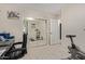 Home office with mirrored closet showing an exercise area at 17705 N Vera Cruz Ave, Maricopa, AZ 85139