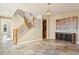 Elegant foyer with travertine tile, a staircase with wood and iron railings, and a decorative console table at 17893 N 93Rd St, Scottsdale, AZ 85255