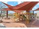 A colorful community playground with shade structures provides safe outdoor recreation at 17893 N 93Rd St, Scottsdale, AZ 85255