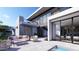Backyard with a modern outdoor living space, a pool, and large windows offering seamless indoor-outdoor flow at 1830 E Palmaire Ave, Phoenix, AZ 85020