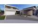 Contemporary two-story home with desert landscaping, stone accents, and a two-car garage at 1830 E Palmaire Ave, Phoenix, AZ 85020