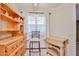 Bright dining area with natural light, built-in hutch, and tile flooring at 19481 N Star Ridge Dr, Sun City West, AZ 85375