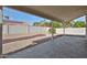 An outdoor backyard with a covered patio and desert landscaping at 19824 N 94Th Ln, Peoria, AZ 85382