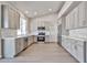 Bright kitchen boasts gray cabinets, stainless appliances, and ample counter space at 19824 N 94Th Ln, Peoria, AZ 85382