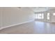 Spacious living room with wood floors, neutral walls, and a large window at 19824 N 94Th Ln, Peoria, AZ 85382