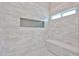 Beautiful shower with white subway tile, shower niche and integrated bench seating at 19824 N 94Th Ln, Peoria, AZ 85382